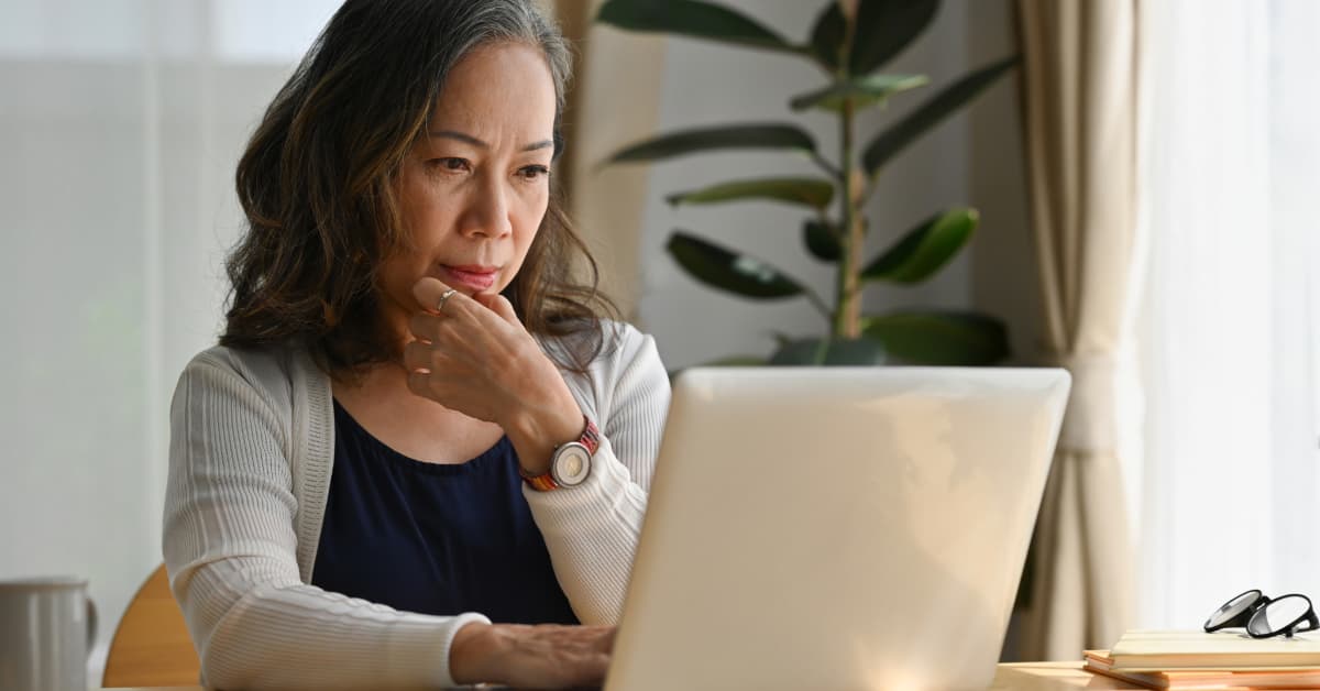 Older woman searching for nutrition advice on her computer