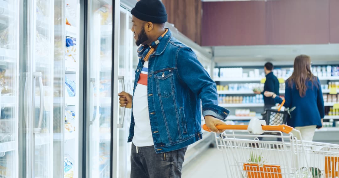 man shopping for frozen vegetables 