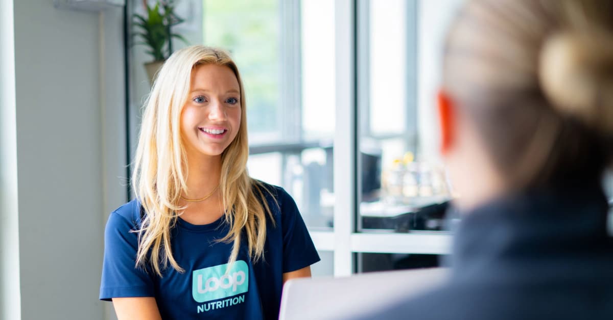 A female dietitian from Loop Nutrition meeting with a client during a session