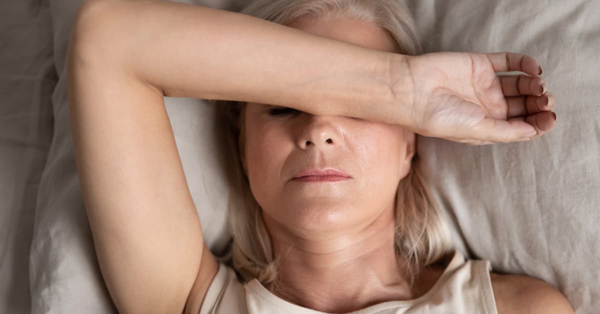 middle aged woman suffering from perimenopause symptoms