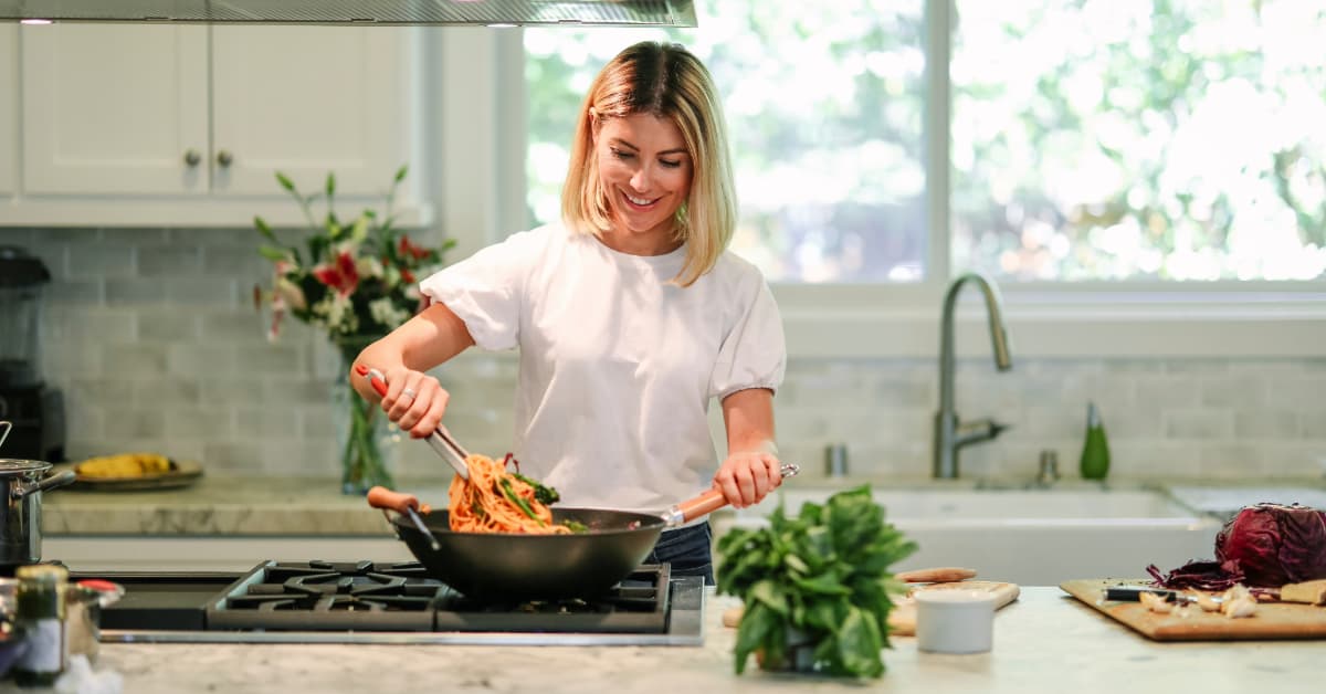 woman cooking a balanced meal 